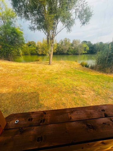 View of double swim from kitchenette on 1.5 acre lake.